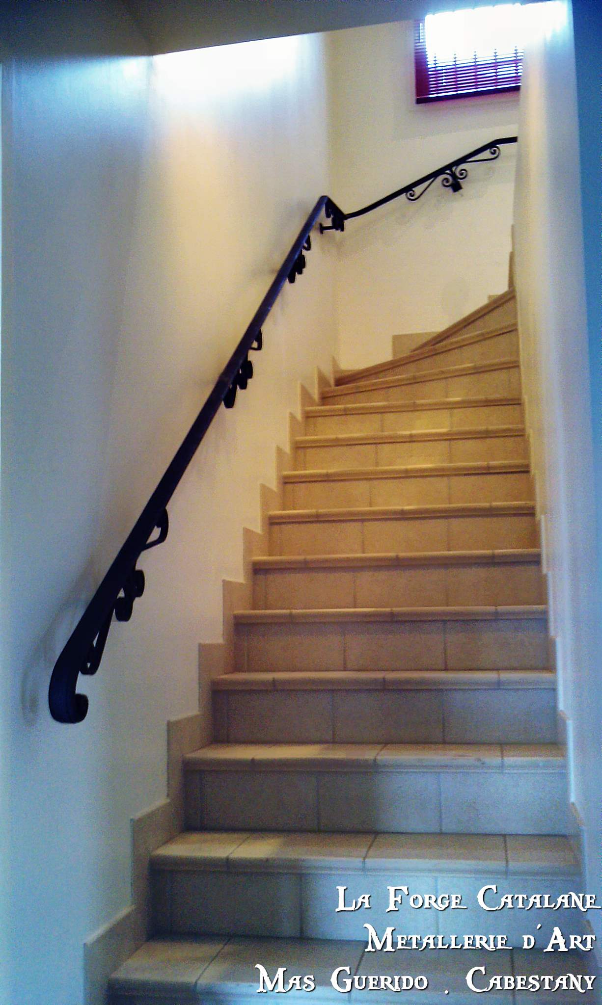 Main courante debillarde  mouluree volutes crosse forge catalane.jpg